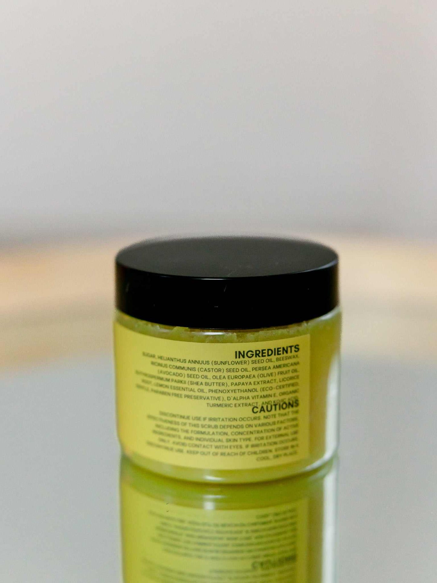 Turmeric scrub for dark spots with organic turmeric, kojic acid, sugar exfoliant, and moisturizing oils in an 8 oz oily formula for brightening and even skin tone