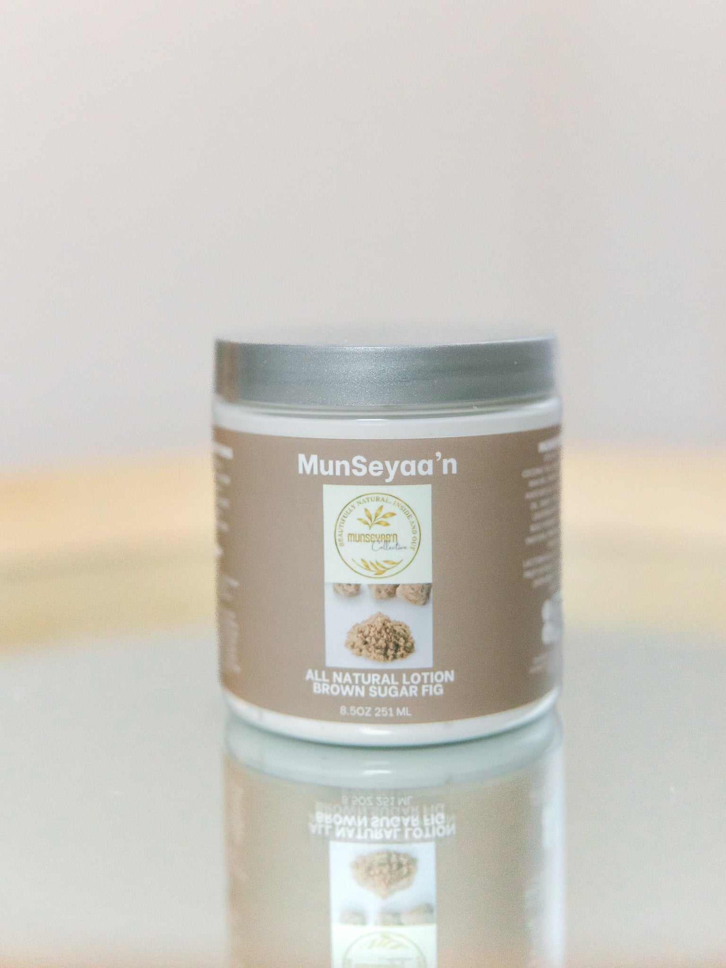 Bottle of Brown Sugar Fig Lotion with natural oils and hydrating ingredients on a white background