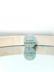 Jar of natural peppermint lip balm with moisturizing ingredients and protective formula